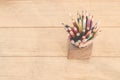 Group of color pencils in a wood cup . Royalty Free Stock Photo