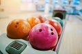 A group of colored bowling balls at bowl lift