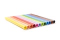 Group of colored crayons on white background side view