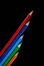 GROUP OF COLORED PENCILS ALIGNED ON BLACK BLACKGROUND Royalty Free Stock Photo