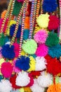 Group of colored Peruvian tassels for sale at the Cusco market.