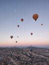 Group of colorful balloons flying at dawn in Cappadocia, Turkey