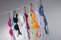 Numerous Colorful Bras Are Hung On A Close Line In A Studio Environment