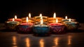 group of colorful candles lit in a ring, in the style of orient-inspired, contrasting light and shadow, indian traditions