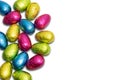 Chocolate Easter eggs wrapped in colorful foil isolated on white background. Royalty Free Stock Photo