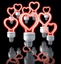 Group of colorful fluorescent lamps, heart shaped, red glow, 3d rendering on dark background Royalty Free Stock Photo