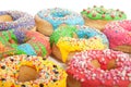 A group of colorful glazed donuts