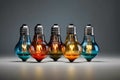 Group of colorful glowing light bulbs arranged in line