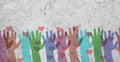 Group of colorful hands with hearts on a wall, volenteer concept, charity and friendship, support teamwork