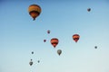 Group of colorful hot air balloons against a blue sky Royalty Free Stock Photo