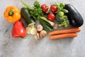 Group of colorful organic vegetables on a gray background with copy space, healthy eating concept, high angle view from above Royalty Free Stock Photo