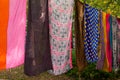 Group of colorful shawls kerchiefs on the string.