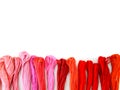 Group of colorful spools of sewing thread top view on white background