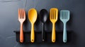 A group of colorful spoons and forks are lined up on a black holder, AI