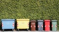 Group of coloured recycling bins on the street for paper plastic organic dry can and glass in Italy