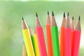 group of colourful sharp pencil on blur green nature background with bokeh Royalty Free Stock Photo