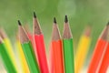 group of colourful sharp pencil on blur green nature background with bokeh Royalty Free Stock Photo