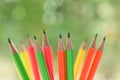 group of colourful sharp pencil on blur green nature background with bokeh Royalty Free Stock Photo