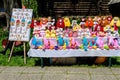 Group of colourful textile traditional hand made decorations, dolls and toys for children, available for sale at a traditional