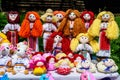 Group of colourful textile traditional hand made decorations, dolls and toys for children, available for sale at a traditional