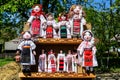 Group of colourful textile traditional hand made decorations, dolls and  toys for children, available for sale at a traditional Royalty Free Stock Photo