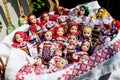 Group of colourful textile traditional hand made decorations, dolls and  toys for children, available for sale at a traditional Royalty Free Stock Photo