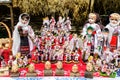 Group of colourful textile traditional hand made decorations, dolls and toys for children, available for sale at a traditional Royalty Free Stock Photo