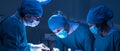 Group of concentrated surgical doctor team doing surgery patients in hospital operating theater. Professional medical team doing Royalty Free Stock Photo