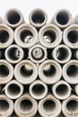 Group of concrete sewer pipes stacked at factory