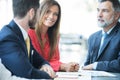 Group of confident business partners interacting at meeting