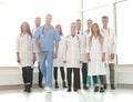 group of confident doctors striding in the hospital corridor