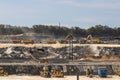 Group of construction trucks working at the site