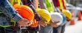 The group of construction workers holding colorful safety helmets outdoors..AI generated image Royalty Free Stock Photo
