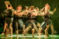 Group of contemporary dancers performing on stage