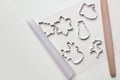 Group of cookie cutters on bakery paper with copy space