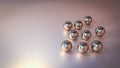 Group of Copper glass spheres on the surface of the surface. Abstract silver glossy balls on reflect gradient background. Shapes. Royalty Free Stock Photo