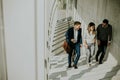 Group of corporate business professionals climbing at stairs in office corridor Royalty Free Stock Photo