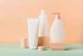 Group cosmetics various tubes bottles modern abstract podium pastel background