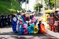 Group of costumed people pose for a photo during the pre-Carnival Fuzue parade