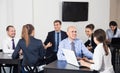 Group of coworkers with laptops on business project in office Royalty Free Stock Photo