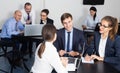 Group of coworkers with laptops having a productive day Royalty Free Stock Photo