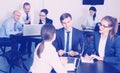 Group of coworkers with laptops having a productive day Royalty Free Stock Photo