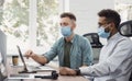 Group of coworkers people discussing business ideas while working in the office wearing medical protective face masks Royalty Free Stock Photo