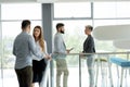 Group of coworkers working together on business project in modern office