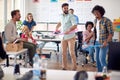 Group of creative casual corporate coworkers having fun