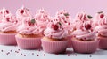 A group of cupcakes with pink frosting and sprinkles Royalty Free Stock Photo