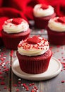 a group of cupcakes with red frosting