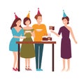 Group of cute joyful people cutting, tasting festive cake and celebrating birthday. Happy man and women enjoying party
