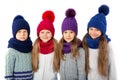 Group of cute kids in winter warm hats and scarfs on white. Children winter clothes Royalty Free Stock Photo