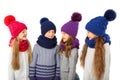 Group of cute kids in winter warm hats and scarfs on white. Children winter clothes Royalty Free Stock Photo